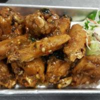 Peek Kai Tod / Gan’S Chicken Wings · Deep-fried chicken wings tossed with Gan’s hot sauce.