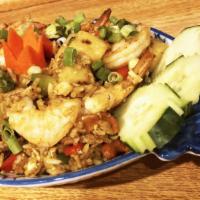 Khao Pad Subpraroat / Pineapple Fried Rice · Stir-fried rice with egg, grilled fresh pineapple, with onions, tomatoes, cashew nuts, green...