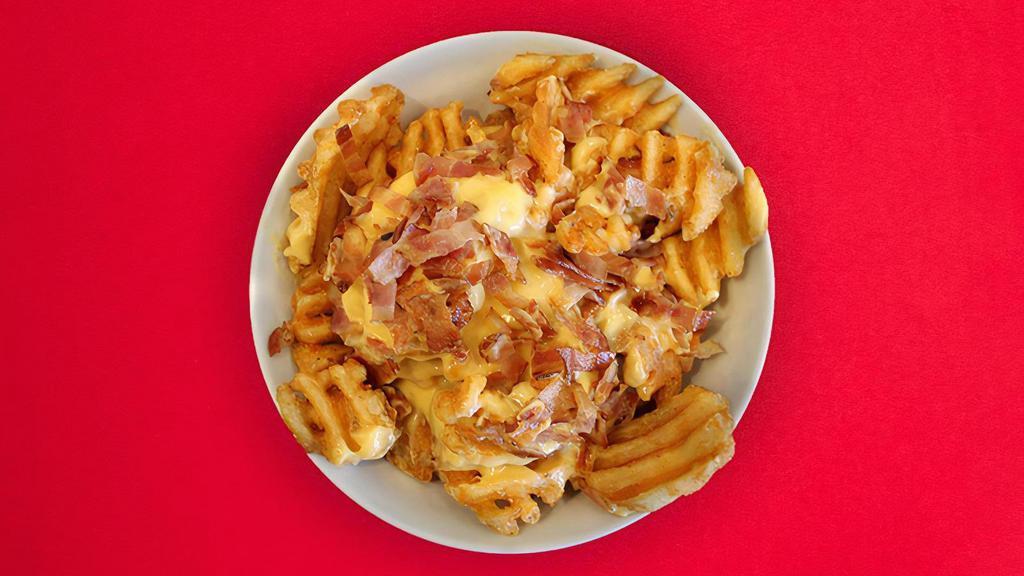 Loaded Waffle Fries · Our signature Waffle Fries covered in melted cheese and crispy bacon! 487 cal.