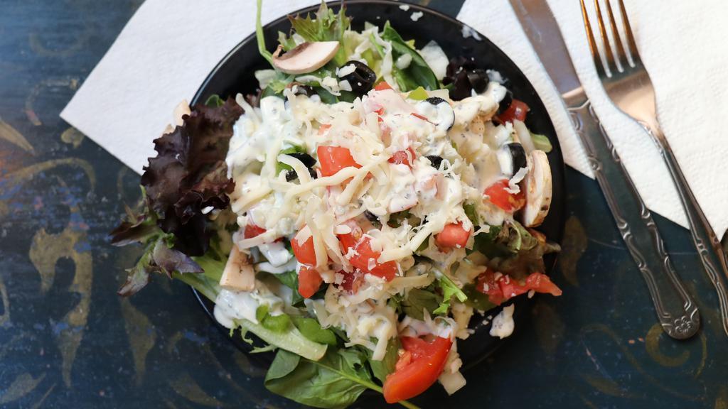 Side Garden Salad · 1/2 Garden Salad with Green Peppers, Black Olives, Mushrooms, Tomatoes, and Red Onion with Romaine Blend