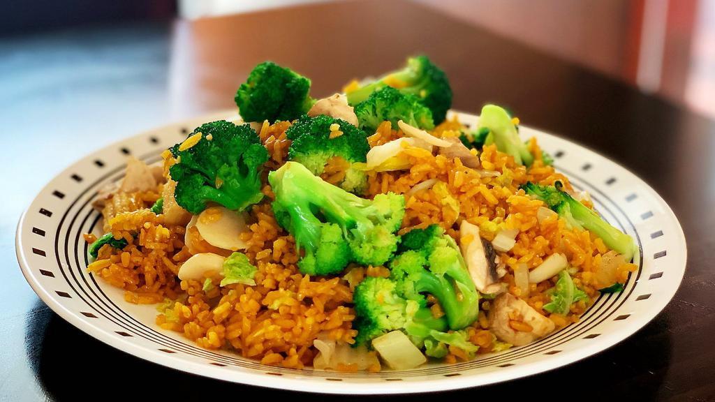 Vegetable Fried Rice · Fried rice with broccoli, bean spout, cabbage, mushroom, zucchini, soy sauce, peas, carrots, and onions.