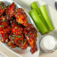 Chicken Wings · Our slow smoked wings. Available in Hot, Mild, Teriyaki, BBQ, Sriracha BBQ, or our favorite,...