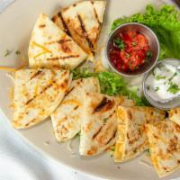 Chicken Quesadillas · Two quesadillas with chicken, cheese, and chopped jalapeños. Served with salsa and sour cream.