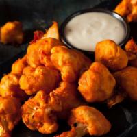 Spicy Buffalo Cauliflower · Fried fresh breaded cauliflower golden brown tossed in house-made buffalo sauce and topped w...