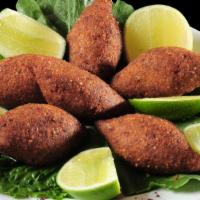 Fried Kibbeh Plate · 5 pieces of meatballs stuffed with ground beef, onion & pine nuts. Deep-fried & served with ...