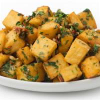 Spicy Potatoes · Diced potatoes sautéed in olive oil, cilantro, jalapeño & garlic.