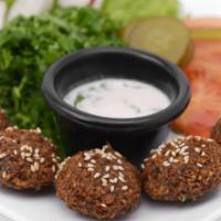 Falafel Plate · 6 pieces of fried vegetable patties made of chickpeas, onion, parsley & garlic. Served with ...