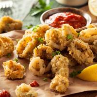 Calamari · Fried hand breaded buttermilk marinated calamari & served with our house sauce.