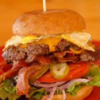 Sky Burger · fresh ground beef, lettuce, tomatoes, grill onion & mushroom, Swiss cheese, turkey bacon wit...