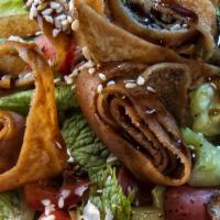 Fattoush Salad · Romaine lettuce, tomatoes, parsley, red cabbage, cucumber, sweet peppers, fried pita chips w...