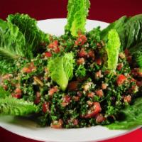 Tabbouleh Salad · Persley, ground wheat, tomatoes, green onions, mint with fresh lemon juice & olive oil.