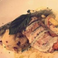 Salmon À La Crema · Char-grilled Atlantic salmon topped with artichokes in cream sauce served mashed potatoes & ...