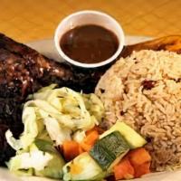 Our Famous Jerk Chicken Dinner · wood smoked chicken in our housemade jerk marinade. Served with coconut rice & peas, braised...