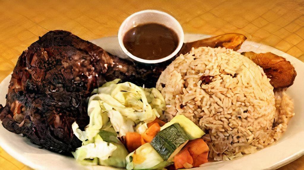 Our Famous Jerk Chicken Dinner · wood smoked chicken in our housemade jerk marinade. Served with coconut rice & peas, braised cabbage, and sweet plantains. Yah mon!