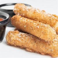 Mozarella Sticks · Eight golden brown cheese sticks sprinkled with Parmesan cheese. Served with marinara sauce.