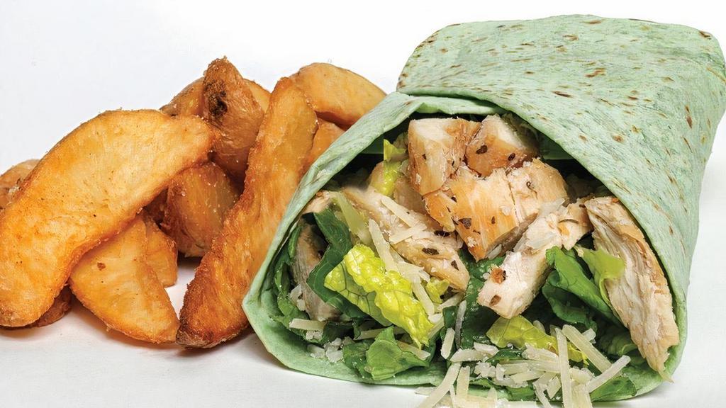 Chicken Caesar Wrap · Grilled chicken, Parmesan cheese and Buddy’s Original Caesar dressing wrapped in a spinach lavash.