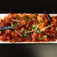 Chilli Chicken+Naan · Deep fried chicken sautéed with onions, bell peppers and green chilies.