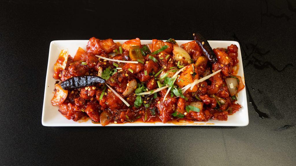 Chilli Chicken+Naan · Deep fried chicken sautéed with onions, bell peppers and green chilies.