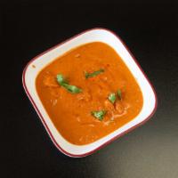 Chicken Makhni Or Butter Chicken · Boneless pieces of chicken roasted in a clay oven and cooked in a mild buttery and tomato sa...