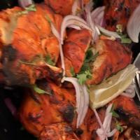 Tandoori Chicken With Bone · Whole chicken marinated in exotic spices, cooked in clay oven.