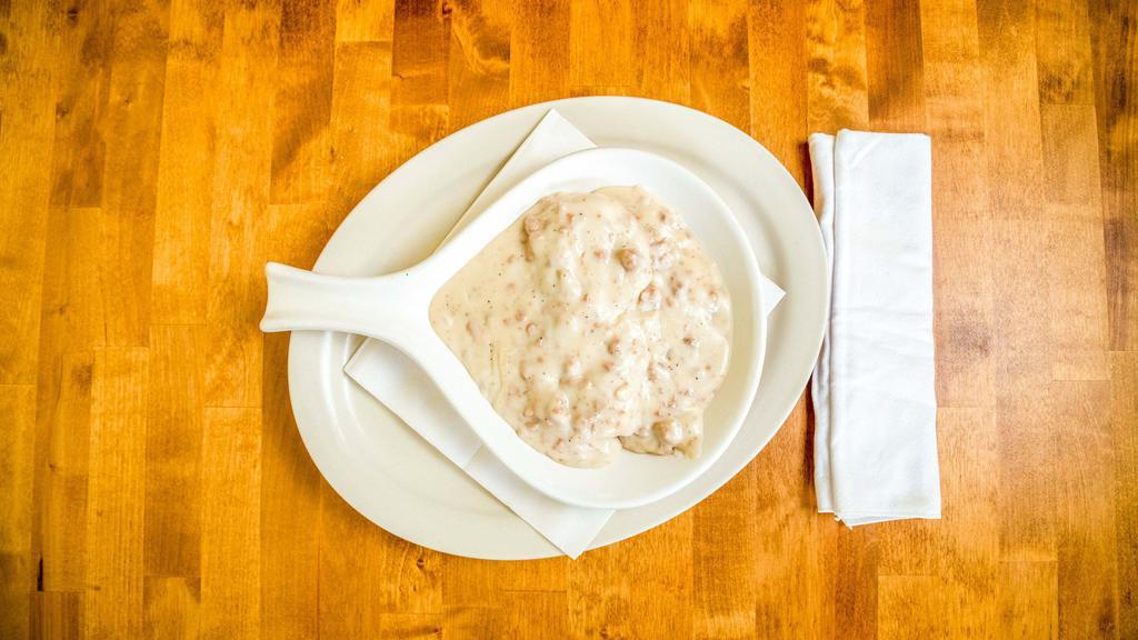 Biscuit & Gravy Combo · 2 any style eggs & choice of breakfast meat smothered in sausage gravy.
