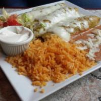 Burrito Surf And Turf  · Filled with steak, shrimp, lettuce, tomato, cheese & refried beans