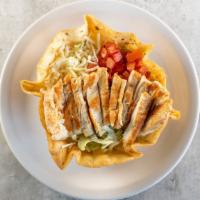 Grilled Chicken Taco Salad · Crispy flour shell filled with grilled chicken breast, lettuce, cheese, and tomato with sour...