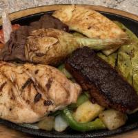 Parrillada
 · The ultimate skillet. A combination of grilled steak, grilled chicken breast, chorizo, and g...
