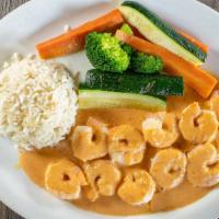 Camarones Chipotle · Shrimp simmered in creamy chipotle sauce. Served with white rice and sautéed vegetables.