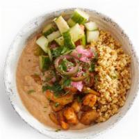 Coconut Shrimp Bowl · cauliflower rice, shrimp mixed in coconut sauce, cucumber-tomato, topped with pickled onion ...