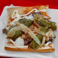 Steak Sandwich · Served on garlic bread with mayo, grilled onions, sweet peppers, a provolone & mozzarella ch...