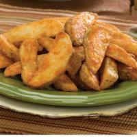 Potato Wedges (16 Oz.) · Thick slices of potatoes seasoned and baked to a golden finish. Crispy on the outside, flaky...