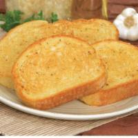 Garlic Bread (4 Pcs.) · Oven-baked bread, brushed with a buttery Garlic Sauce and sprinkled with a blend of spices.