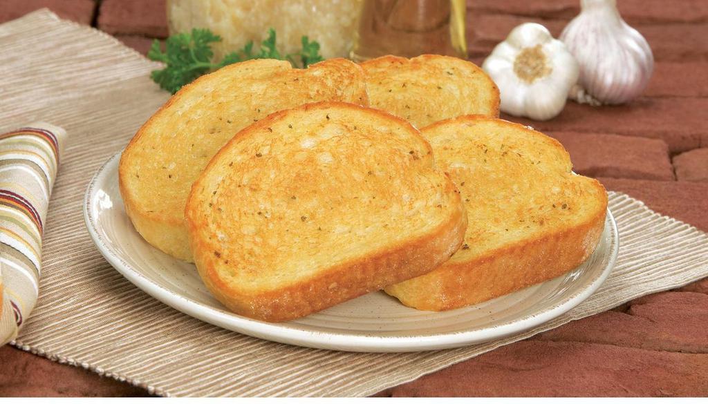 Garlic Bread (4 Pcs.) · Oven-baked bread, brushed with a buttery Garlic Sauce and sprinkled with a blend of spices.