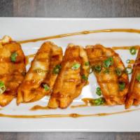 Pork Potstickers · Pork potstickers with a side of Bourbon sauce. Qty: 6.