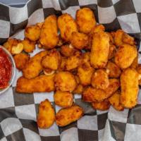 Cheese Curds · Cheese curds served with a side of marinara sauce.
