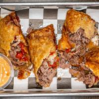 Philly Cheese Steak Egg Rolls · Philly cheese steak, red pepper, green pepper stuffed egg rolls with a side of thousand isla...