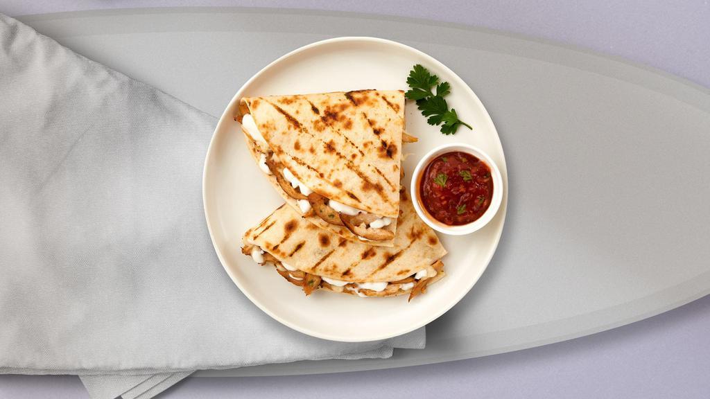 Chicken Quesadilla · Chicken, green peppers, and onions wrapped with cheddar cheese in a grilled tortilla. Served with a side of sour cream and salsa.