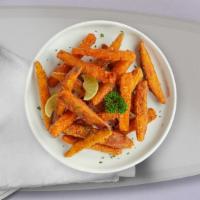 Sweet Potato Fries · (Vegetarian) Thick-cut sweet potato wedges fried until golden brown.