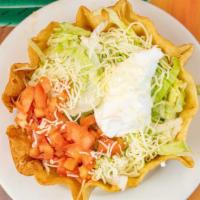 Fajita Taco Salad · Flour tortilla shell filled with pieces of Chicken or beef, lettuce, tomatoes, grated cheese...