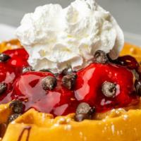 Original All-Berry Waffle · Glazed strawberry, blueberry and raspberry topping. Dusted with powdered sugar and warm mapl...
