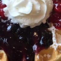 Multi-Grain All-Berry Waffle · Glazed strawberry, blueberry and raspberry topping. Dusted with powdered sugar and warm mapl...