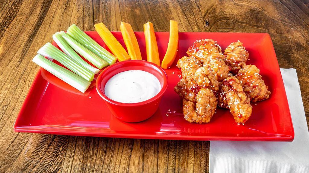 Boneless Chicken Wings · Boneless chicken wings, deep fried and coated in your choice of sauce. Includes carrots, celery sticks and choice of dipping sauce