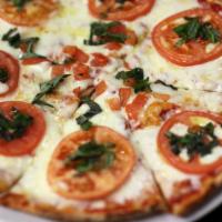 Margherita Pizza · Sliced tomatoes, basil, olive oil, and mozzarella.