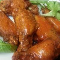 Fresh Chicken Wings · Chef favorites. Dry-rubbed fresh chicken wings. Served naked or tossed in our special srirac...