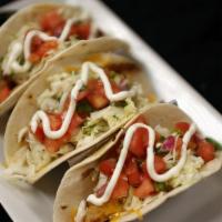 Fish Tacos (3) · Blackened tilapia, white cabbage, and jalapeño slaw, with a 3-cheese blend and flour tortill...
