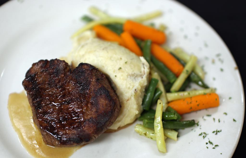 Filet Mignon · Chef favorites. Hand-cut filet topped with zip sauce. Served with garlic mashed potatoes and fresh vegetables. Add Grilled Shrimp, Sautéed Onion, Sautéed Mushroom for additional charges. Add additional charge for each additional ounce up to 12 ounces.
