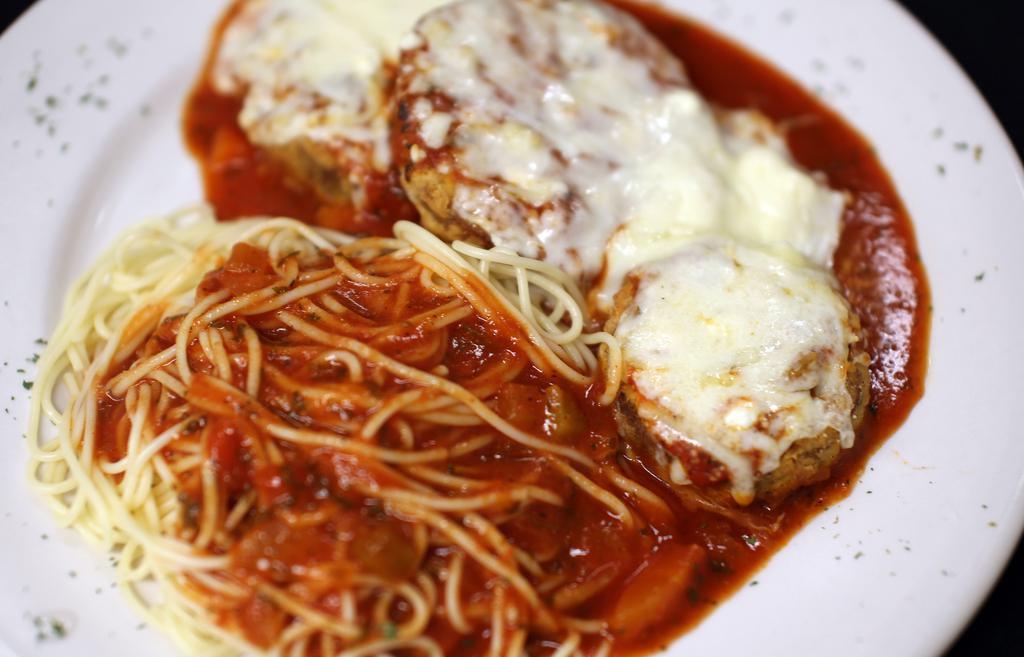Eggplant Parmesan · Fresh breaded eggplant, marinara, baked four-cheese blend, and a side of pasta with marinara.