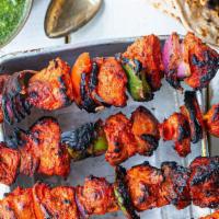 Chicken Tikka (Half) · Skinless breast of chicken marinated in mildly spiced marinade. Served with onions, green pe...