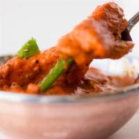Chicken Tikka Masala · Breasts of chicken deboned and cooked in a tastefully seasoned delicate onion, tomato, and c...